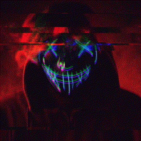 A Person Wearing A Glow In The Dark Mask With A Skull On It . GIF