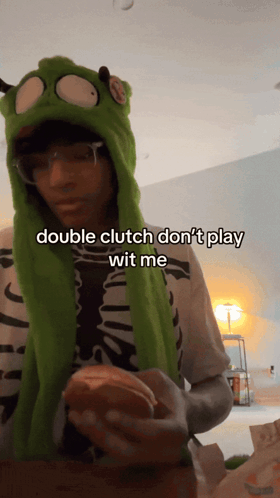 A Person Wearing A Green Hat Says Double Clutch Don T Play Wit Me GIF
