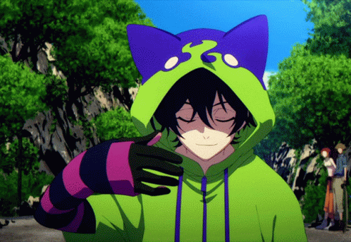 A Person Wearing A Green Hoodie With A Cat Ear On It GIF