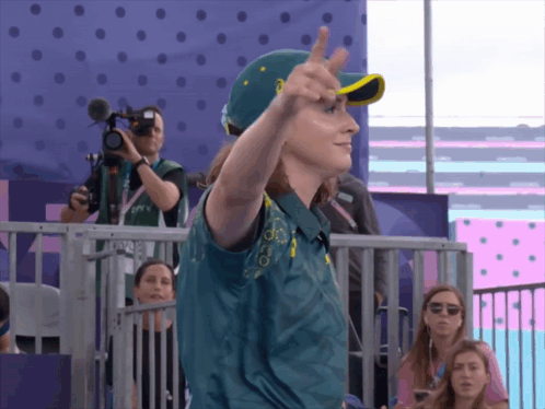 A Person Wearing A Green Shirt With The Word Australian On It GIF