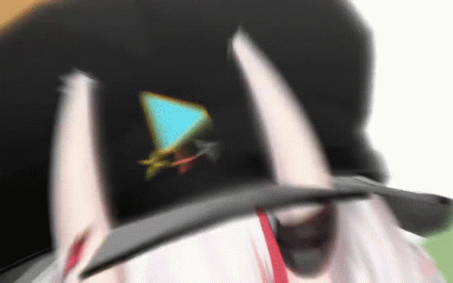 A Person Wearing A Hat With A Triangle On It GIF