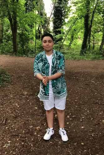 A Person Wearing A Hawaiian Shirt And White Shorts GIF