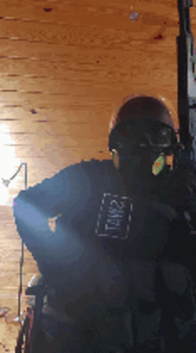 A Person Wearing A Helmet And A Shirt That Says Tnw21 GIF