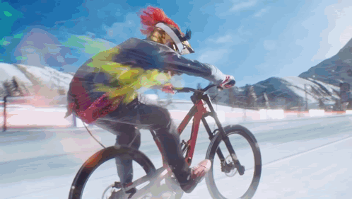 A Person Wearing A Helmet And Goggles Is Riding A Bike GIF