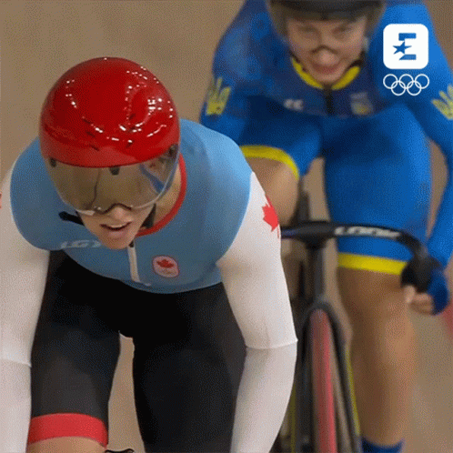 A Person Wearing A Helmet And Goggles Is Riding A Bike Next To Another Person GIF