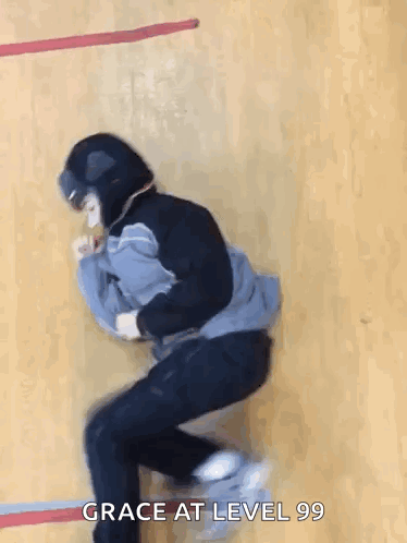 A Person Wearing A Helmet Is Jumping In The Air With The Words Grace At Level 99 Below Them . GIF