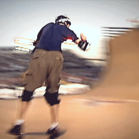 A Person Wearing A Helmet Is Riding A Skateboard GIF