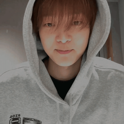 A Person Wearing A Hoodie Giving A Thumbs Up Sign GIF