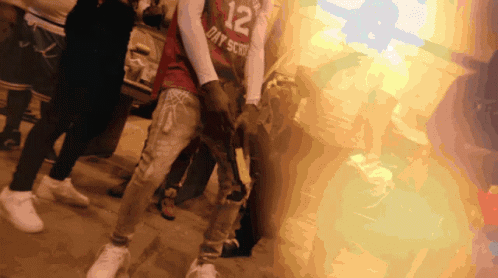A Person Wearing A Jersey That Says 12 On It GIF