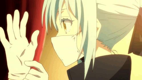A Person Wearing A Mask And White Gloves Making A Stop Sign GIF