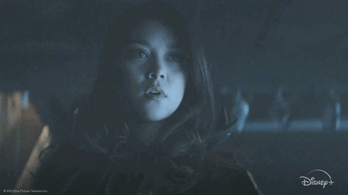 A Person Wearing A Mask With A Disney Logo On The Bottom Right GIF