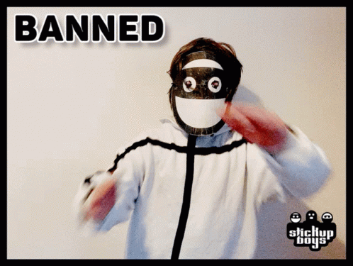 A Person Wearing A Mask With The Word Banned Written On It GIF