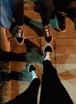 A Person Wearing A Pair Of Black Vans Sneakers GIF