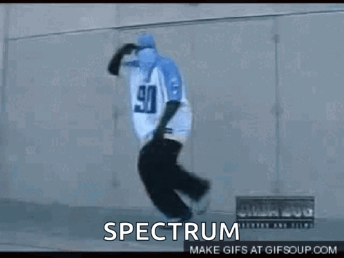 A Person Wearing A Pair Of Blue Slippers With The Word Spectrum On The Bottom GIF