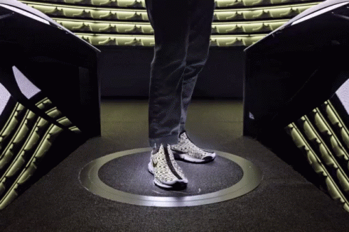 A Person Wearing A Pair Of Nike Shoes Is Standing In A Circle GIF