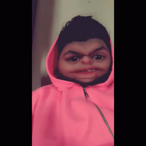 A Person Wearing A Pink Hoodie With A Zipper On The Front GIF