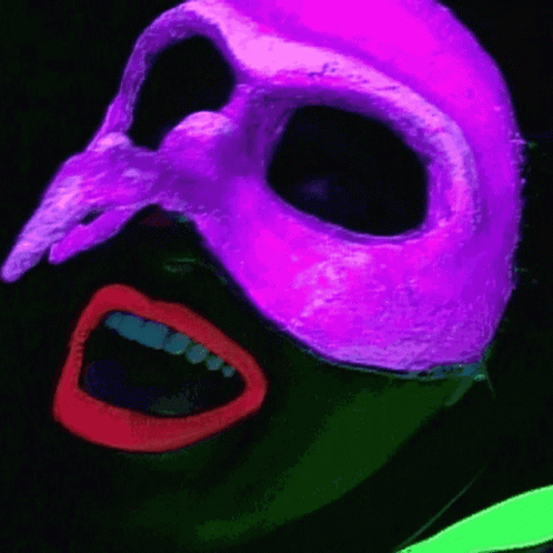 A Person Wearing A Purple Mask With A Skull On It GIF