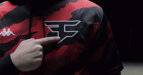 A Person Wearing A Red And Black Shirt With The Letter F On The Chest GIF