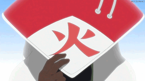 A Person Wearing A Red And White Hat With A Red Symbol On It GIF