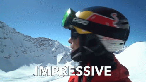 A Person Wearing A Red Bull Helmet And Goggles With The Words Impressive Below Them GIF