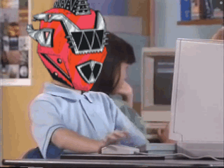 A Person Wearing A Red Helmet With The Letter W On It Is Sitting In Front Of A Computer GIF