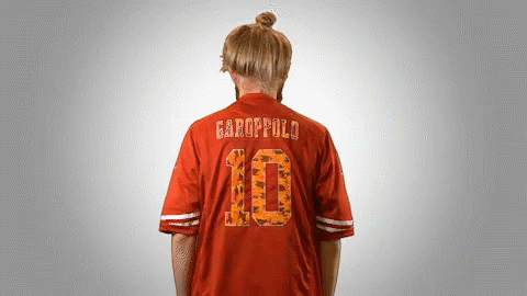 A Person Wearing A Red Jersey With The Number 10 On It GIF