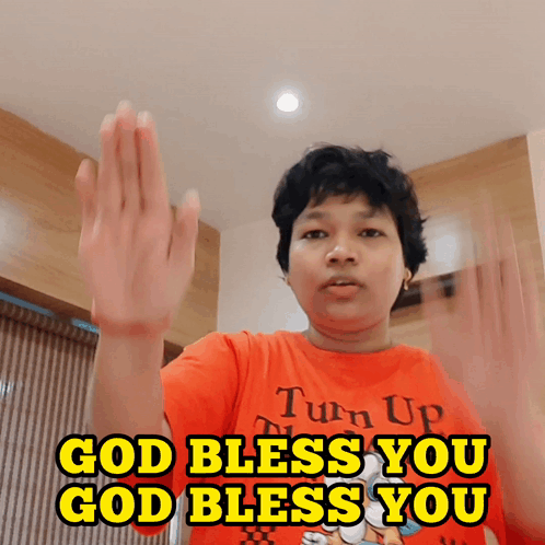 A Person Wearing A Red Shirt That Says Turn Up And Says God Bless You GIF