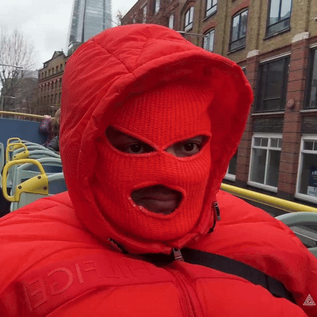 A Person Wearing A Red Ski Mask And A Red Jacket With The Word Ice On The Front GIF