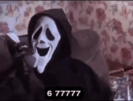 A Person Wearing A Scream Mask Is Sitting On A Couch With A Hoodie On . GIF
