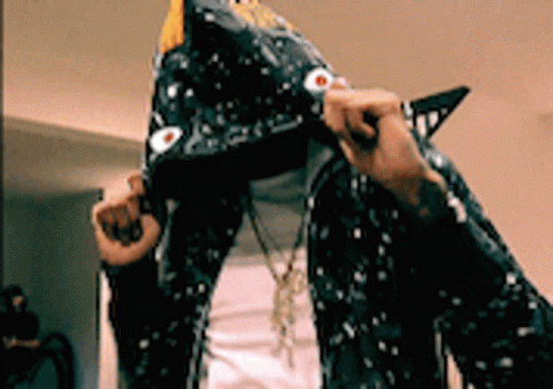 A Person Wearing A Shark Costume With A Hood GIF