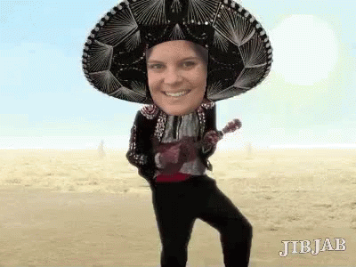A Person Wearing A Sombrero And Holding An Ukulele . GIF