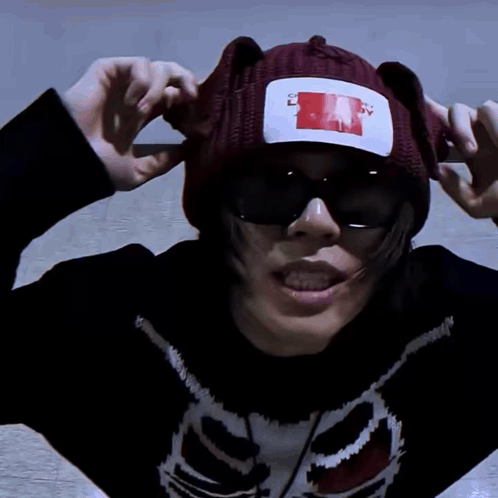 A Person Wearing A Sweater With A Skeleton On It And A Beanie That Says " I Love You " On It GIF