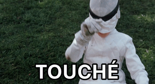 A Person Wearing A White Costume With The Word Touche Written On It GIF