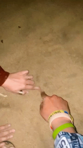 A Person Wearing A Wristband That Says " Space " On It GIF