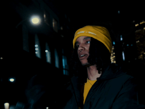 A Person Wearing A Yellow Beanie That Says " I Know I Know " On It GIF