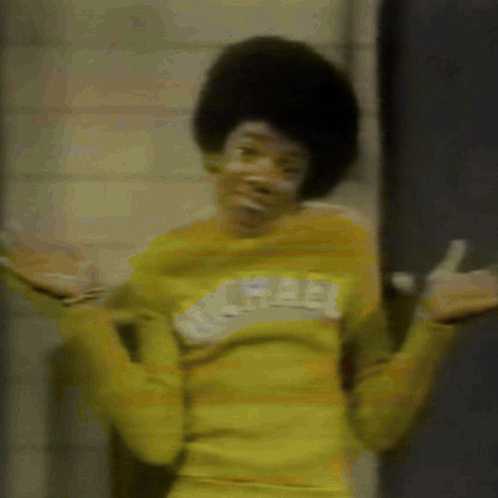 A Person Wearing A Yellow Shirt With The Word Free On The Front GIF