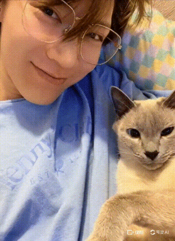 A Person Wearing Glasses And A Blue Shirt That Says Chunky On It GIF