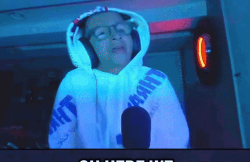 A Person Wearing Headphones And A Hoodie That Says Light GIF