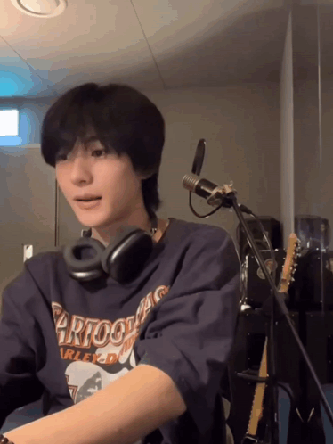 Person Wearing Headphones And Harley Davidson Shirt GIF