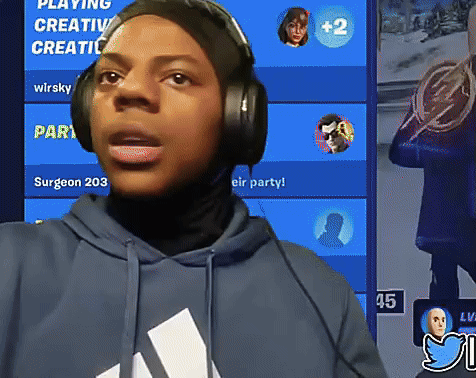 A Person Wearing Headphones Is Standing In Front Of A Blue Screen That Says Playing Creative Creative GIF