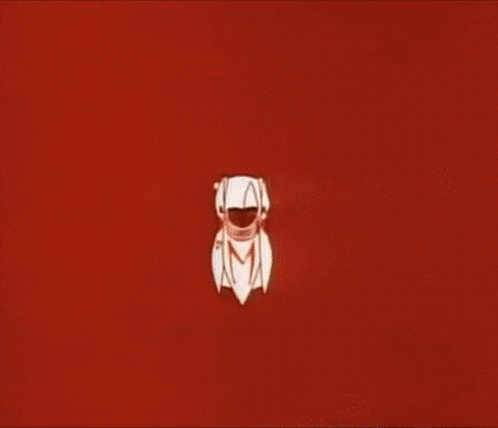 A Person Wearing Orange Gloves Is Pressing A Button GIF