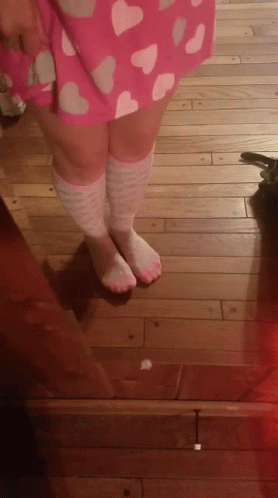 A Person Wearing Pink And White Knee High Socks GIF
