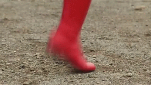 Person In Red Boots Walking On Dirt Path GIF