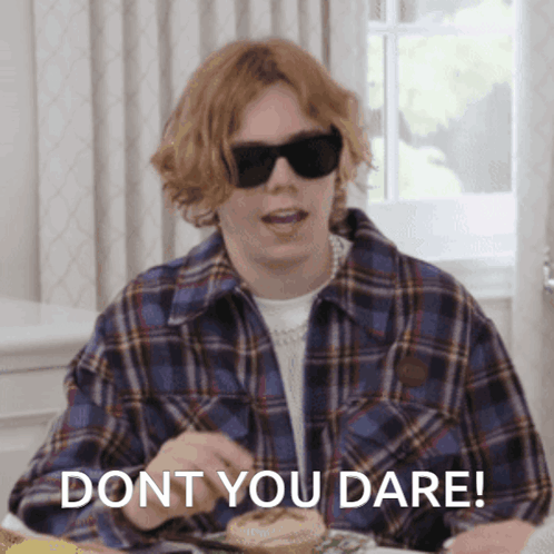 A Person Wearing Sunglasses And A Plaid Shirt Says " Dont You Dare " GIF
