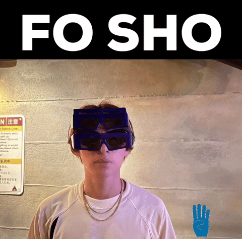 A Person Wearing Sunglasses And A Sign That Says N On It GIF