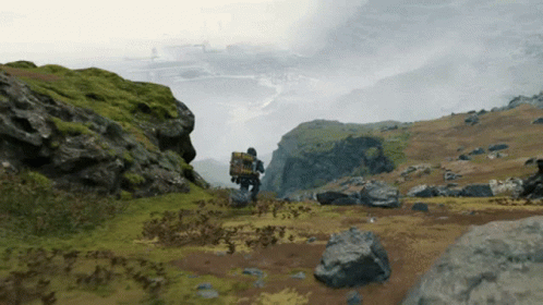 A Person With A Backpack On Their Back Is Walking Across A Field GIF