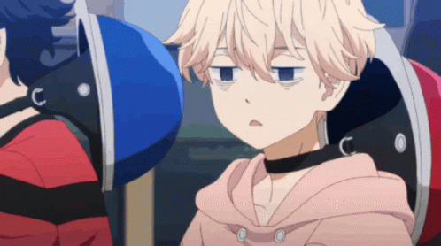 A Person With A Choker Around Their Neck Is Sitting In A Chair GIF