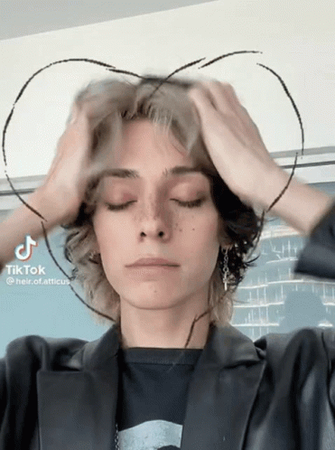 A Person With A Heart Drawn On Their Head Has Tiktok Written On The Bottom Right GIF