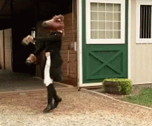 A Person With A Horse Head On Their Head GIF