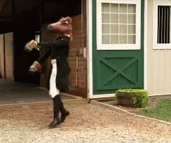 A Person With A Horse Head On Their Head GIF